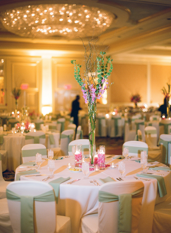 light green and dark pink table setting in a ballroom reception venue - sweet southern military style wedding photo by Charleston wedding photographer Virgil Bunao